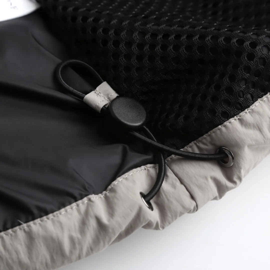 P980 Canada Goose hooded down jacket Fabric selection: Weaved with 400T high-count yarn. After special water-repellent treatment, the surface forms a lotus leaf effect - raindrops will slide down in beads, and snow particles will fall off when touched. The tear resistance reaches 200N (approximately 20kg load-bearing), the light gray matte texture breaks the stereotype of "outdoor clothing = hardcore", and the soft luster presents a high-end matte effect under urban neon lights, seamlessly switching scenes from ski resorts to CBD office buildings.  Process 1: Use polyester woven ribbons as the base, and use high-precision computer embroidery to decorate the brand letters on the ribbons. The edges of the pattern are clear, the stitches are fine and even, and multiple layers of embroidery threads are stacked to enhance the three-dimensional effect.  Process 2: Precision thread reinforcement to prevent velvet drilling and ensure that the fluffy and resilient elasticity lasts as new.  Details: The embedded cuffs are three-dimensionally woven to form a "wavy" elastic structure, forming natural folds when fitting the wrist, increasing the contact area with the skin, thus improving the windproof effect. At the same time, micro-velvet treatment is added to the inside of the cuffs, which feels like a second layer of skin and avoids friction on the skin from metal zippers or hard fabrics.  90 national standard high-quality white duck down: selected high-loft down, weighing 240g, light and warm, with excellent temperature locking performance and good resilience.  Accessories: 1:1 customized armband, 1:1 customized zipper pendant, 1:1 customized elastic buckle, etc. SIZE: S M L XL